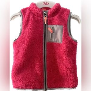 Carter’s girls pink fest with zipper down the front and pocket on the front